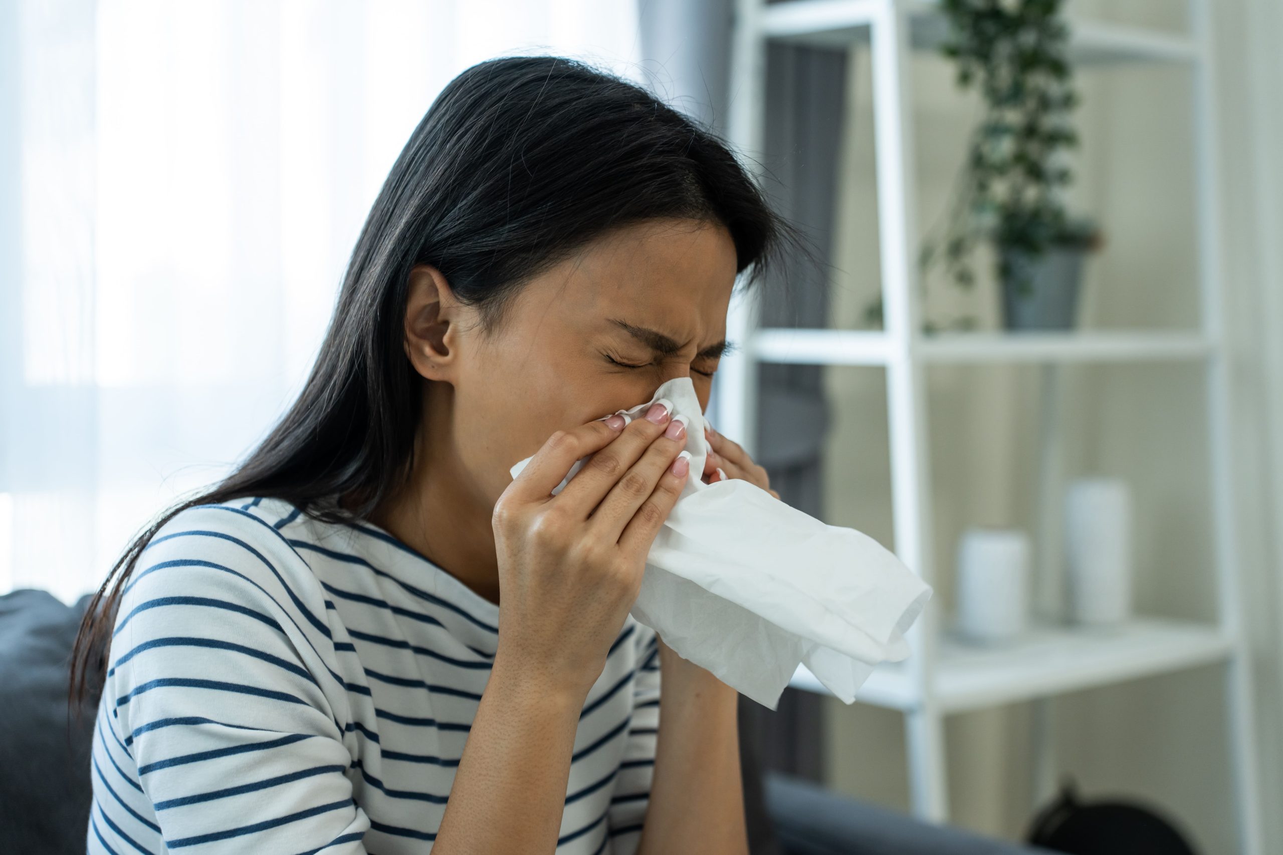 woman-with-cold-blowing-her-nose-with-tissue-2026-03-24-22-42-08-utc (1)